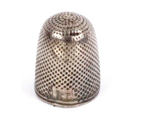 A 17th Century silver thimble for a child, double rim below a panel with single scratch initial.&nbsp; &nbsp; &nbsp; &nbsp; &