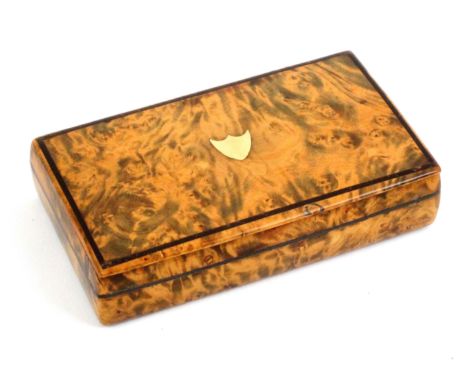 A burr walnut snuff box, of rectangular form with wooden hinge, the lid with a gold shield within an outer ebony line, the si