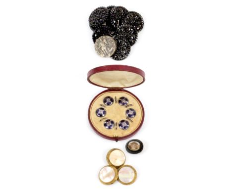 Buttons, comprising a set of six silver and enamel buttons stamped to backs 'Sterling', and fitted into a circular leather ca