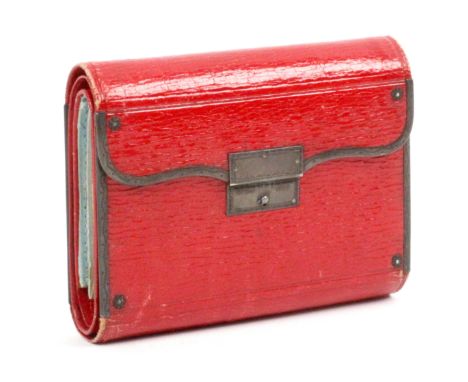 A nice example of a Georgian red leather and silver mounted hussif of purse form, unravelling to reveal five division skein h