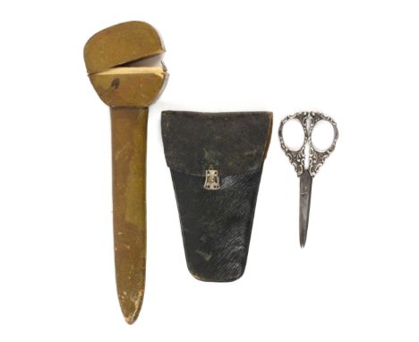 Two leather scissor cases, one with silver mounted scissors, comprising a green leather case with hinged nickel catch contain