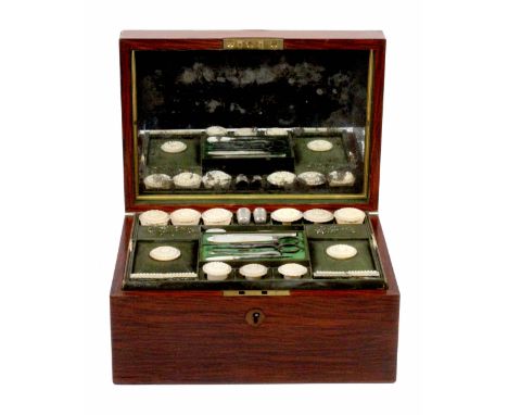 A well fitted partridge wood sewing box by Edwards, circa 1850, of restrained rectangular form, the lid interior lined with a