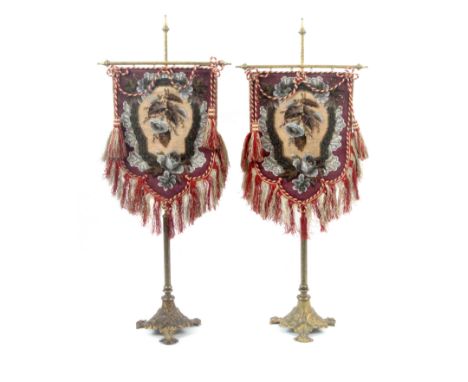 A pair of Victorian bead work table banner screens, on gilt brass floral bases and stands, each with a floral bead work and w