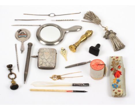 A mixed lot, comprising an engraved silver vesta case, 5.2cms, a miniature silver hand mirror for 'The British Empire Exhibit