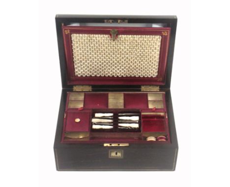 A coromandel wood dome top sewing box of rectangular form, circa 1860, inlaid with brass lines, mother of pearl escutcheon an