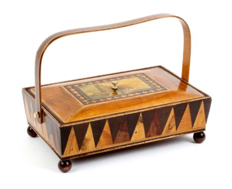 A rosewood inlaid and print decorated Tunbridge ware rectangular sewing pannier, raised on wooden ball feet, the sloping side