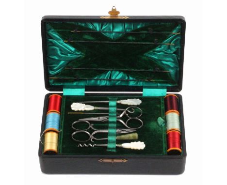 A black leather sewing box, circa 1900, of rectangular form, the interior attractively lined in green silk and velvet, with a