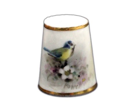 A Royal Worcester puce mark thimble by William Powell, painted with a blue tit amid flowers, within gilt lines, signed 'Powel