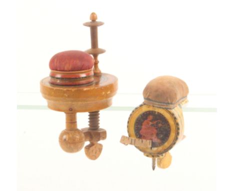 Two early Tunbridge ware painted whitewood sewing clamps, comprising a cylinder form example fitted with a tape measure (cove