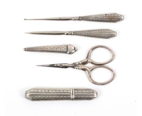 Four continental sewing tools, comprising a delicate pair of steel bladed scissors with silver arms, 7cms, together with an e