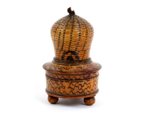 A white wood paint decorated Tunbridge ware pin cushion in the form of a bee skep, the circular box base painted in sponge wo