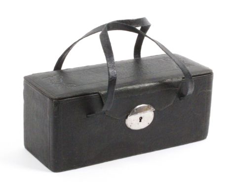 A black leather netting box, circa 1870, of rectangular form the front with oval steel lock plate, the lid tooled and with tw