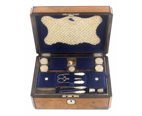 A burr walnut fitted sewing box, circa 1870, of rectangular form with concave and ebony lined corners, mother of pearl escutc