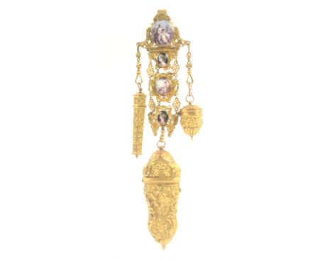 An attractive late 18th Century gilt metal and enamel mounted chatelaine with accessories, the scroll pierced hook mount with