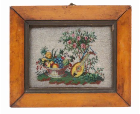 A well executed bead work panel, depicting a basket of fruit and a mandolin on a grassy bank before a rose bush, burr maple g