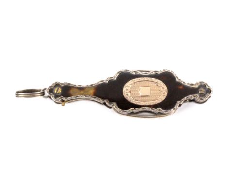 An attractive early 19th Century lorgnette, folding into a tortoiseshell and silver mounted handle, one side inset with an ov