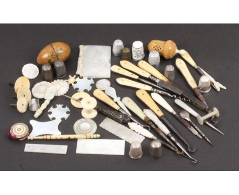 A mixed lot, sewing, comprising fifteen various tools, two mother of pearl stilettos, 7 and 5.5cms, mother of pearl reel, veg