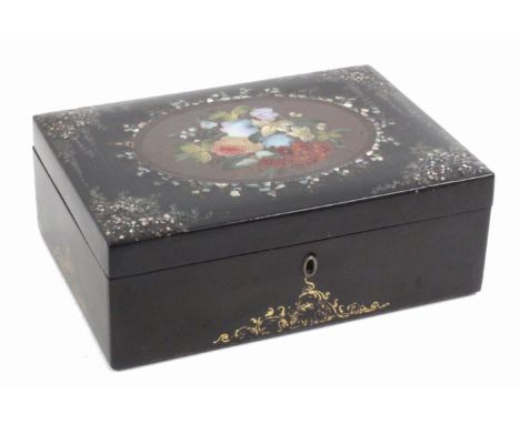 A fitted papier mache sewing box, circa 1850, of rectangular form, the sides with gilt scroll decoration, the lid with a bouq