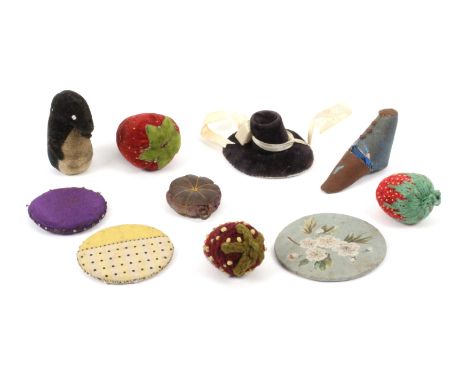 Ten pin cushions and emeries, comprising three various strawberry emeries, three pin discs one floral painted, 5.6cms dia., a