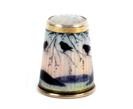 A Norwegian silver gilt and enamel moonstone top thimble by David Anderson, depicting three birds silhouetted on a branch, a 