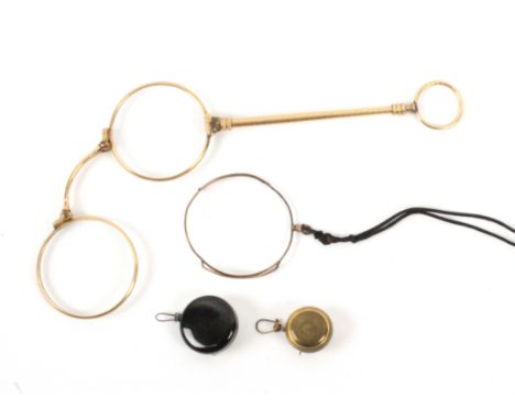 A 19th Century lorgnette and three related items, the gilt metal lorgnette on engine turned tapering stem to a ring suspensio