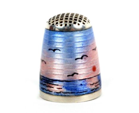 A Norwegian silver and enamel waffle top thimble by Aksel Holmsen, depicting a mountainous water landscape with birds and mid