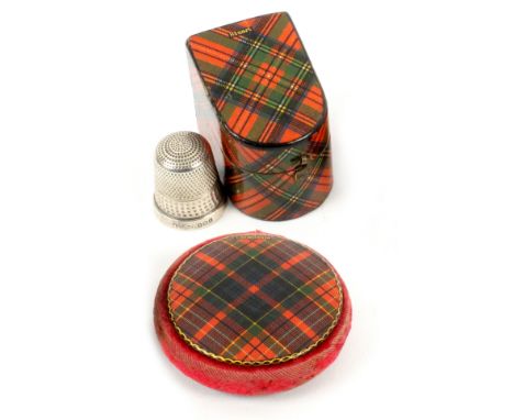 Tartan ware, two pieces, comprising a bow front and slant top thimble case (Stuart), with a silver thimble, 3.5cms, and a dis