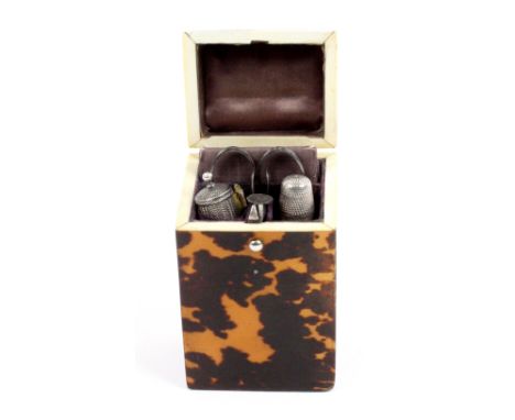A tortoiseshell etui of Lady's Companion form, circa 1840, the cushion lid with white metal tablet, the interior with notelet