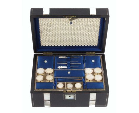 An ebony and pearl inlaid sewing box, circa 1870, of rectangular form, the front and lid with bands of mother of pearl and ab