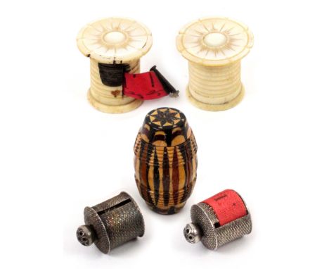 Five tape measures, comprising two similar silver cylinder form tape measures, one lacking tape, one with incomplete tape, 2c