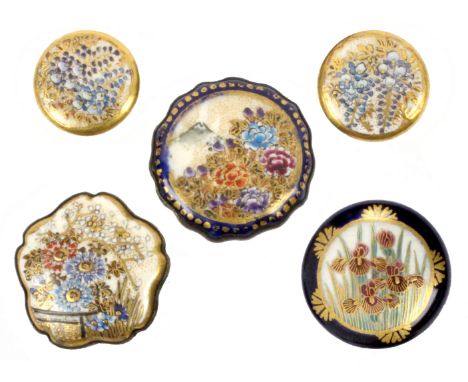 Three Satsuma porcelain buttons and two similar hat pin mounts, comprising a pair of floral pattern with marks verso, 10.6cms