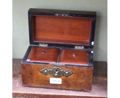 A 19TH CENTURY WALNUT TEA CADDY with decorative brasswork panels 
