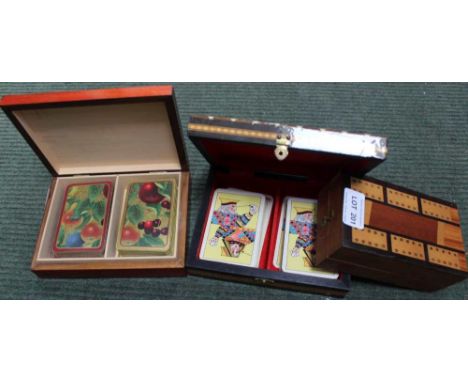 A FOLDING CRIB BOARD together with two decorative boxes of playing cards 