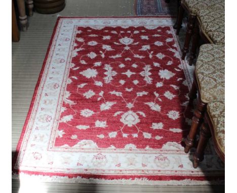 A HAND WOVEN PAKISTANI WOOLLEN FLOOR CARPET based on a Zeigler design 