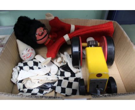 A 'CHAD VALLEY' PAINTED WOOD &amp; BAKELITE TOY TRACTOR, a Guardsman hand puppet, a part Pierrot puppet, and a pair of doll's