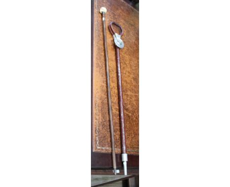 A LEATHER HANDLED METAL SHAFTED FOLDING SHOOTING STICK together with a rosewood finished walking stick, with carved skull pom