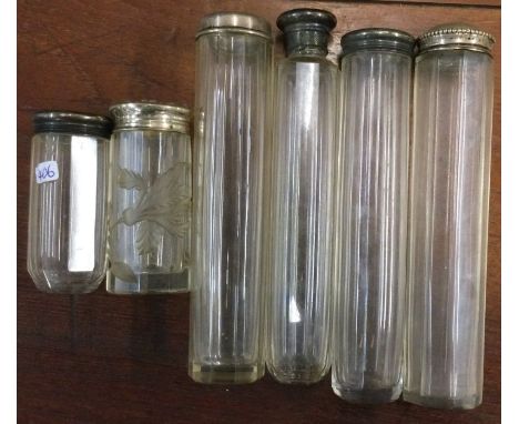 An engine turned silver scent bottle together with four others. Est. £20 - £30.