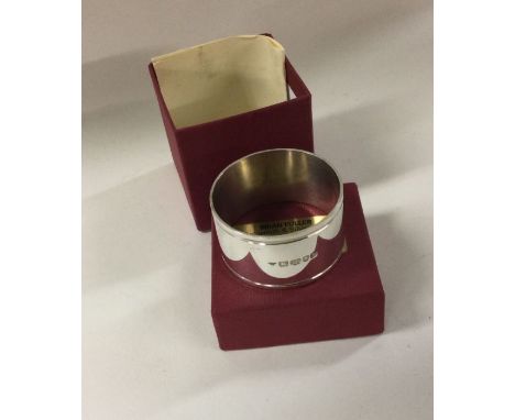 BRIAN FULLER: A cased silver napkin ring dated 2004. Squirrel hallmark. Approx. 35 grams. Est. £30 - £40.