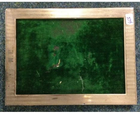 An engine turned Sterling silver picture frame. Est. £25 - £30.