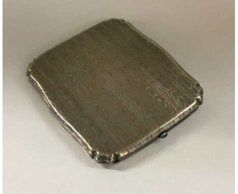 A silver and enamel engine turned cigarette case. Approx. 104 grams. Est. £70 - £80.