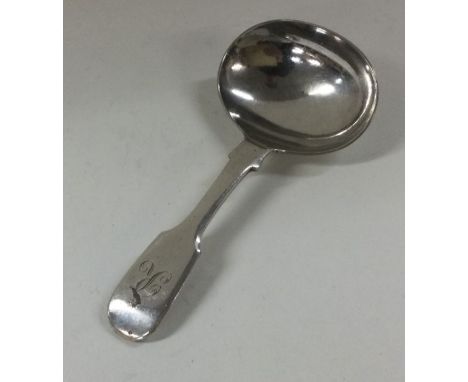 A silver plated caddy spoon. Est. £10 - £20.