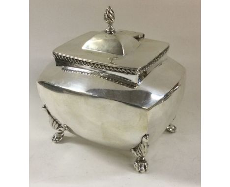 A silver tea caddy on feet. Birmingham 1901. By Thomas Hayes. Approx. 200 grams. Est. £180 - £220.