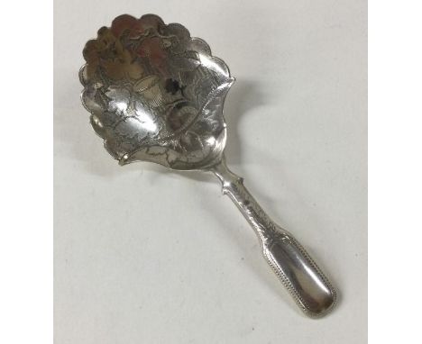 A good Georgian silver caddy spoon with flower and leaf decoration. Birmingham. By IT. Approx. 8 grams. Est. £70 - £80.