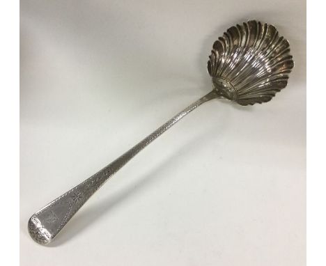 A bright cut silver engraved fluted soup ladle. London 1808. By William Eley, William Fearn and William Chawner. Approx. 163 
