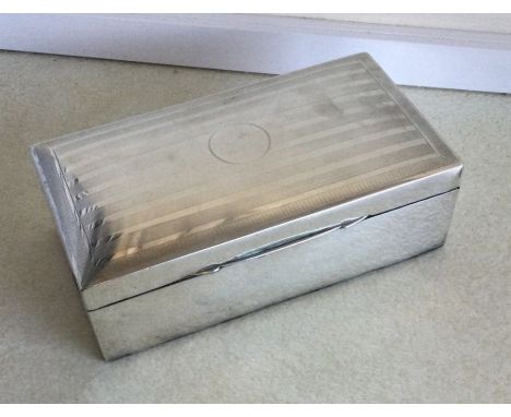A large silver engine turned cigarette box. Birmingham. Approx. 536 grams. Est. £25 - £30.
