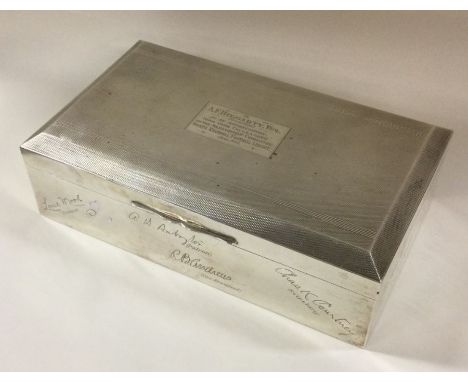 A heavy engine turned silver cigarette box. Approx. 150 grams. Est. £60 - 80.