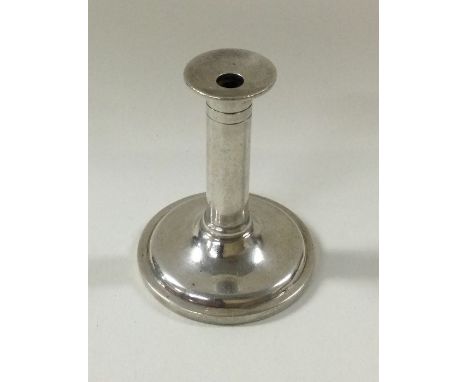 A miniature silver toy candlestick. Circa 1900. Approx. 13 grams. Est. £30 - £50.