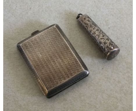 An engine turned silver match case together with a cheroot holder. Approx. 40 grams. Est. £15 - £20.