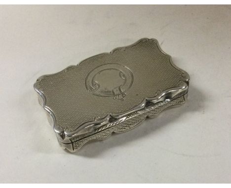 A good Victorian engine turned silver snuff box with gilt interior. Birmingham 1860. Approx. 44 grams. Est. £180 - £220.