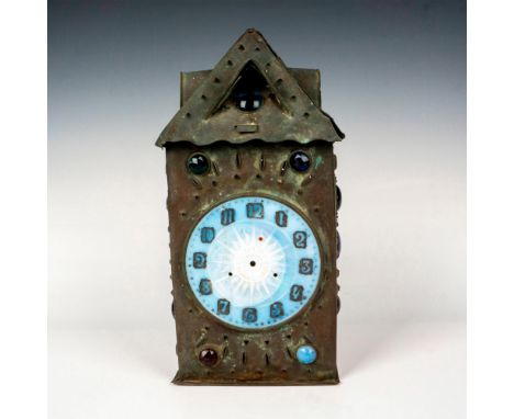 Pierced jewel lantern case with opalescent glass clock face with sun embossed in the center. The hinged back door opens and h